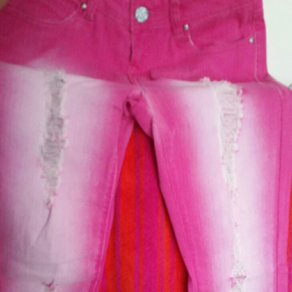 Hot pink distressed skinny jeans